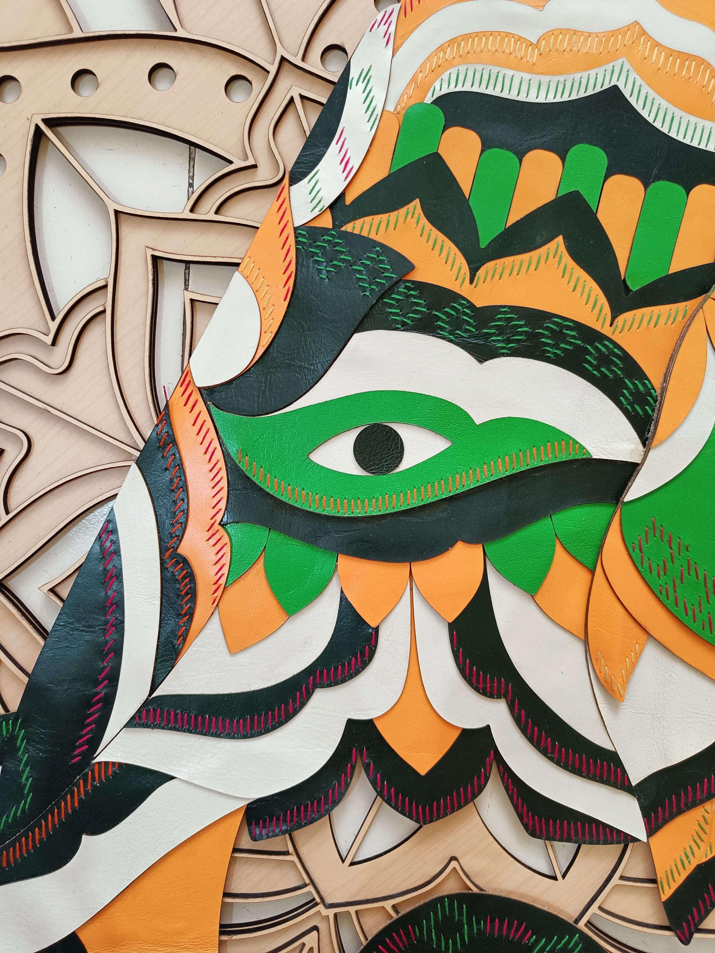 Detail of the carved mandala wood panel at Starbucks Model Town, Jalandhar